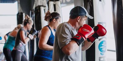 RockBox fitness members in a kickboxing class